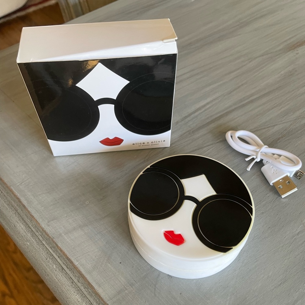 Alice and Olivia Stacey Face phone charger